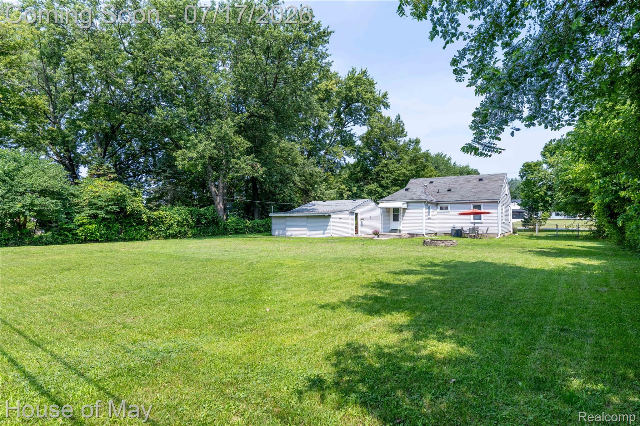 45247 Bemis Road Belleville, MI 48111 - Photo 26 of 28 Expansive green lawn with mature perimeter trees