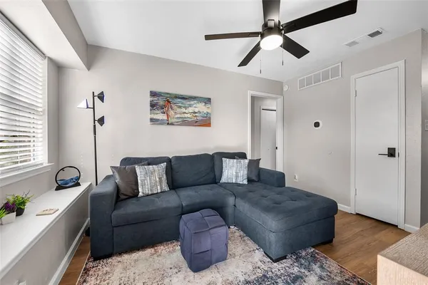 a living room with furniture and a window
