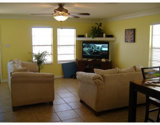 3722 Laguna Shores Road Corpus Christi, TX 78418 - Photo 2 of 8 a living room with furniture and a flat screen tv