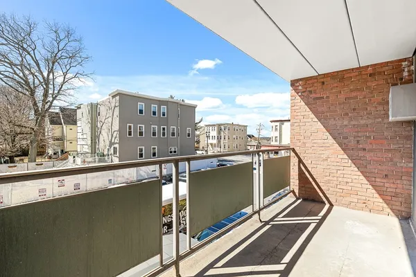a view of balcony with furniture