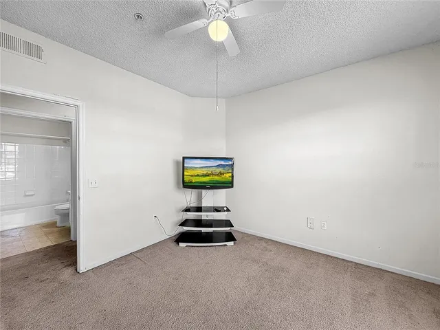 a view of a house with swimming pool and sitting area