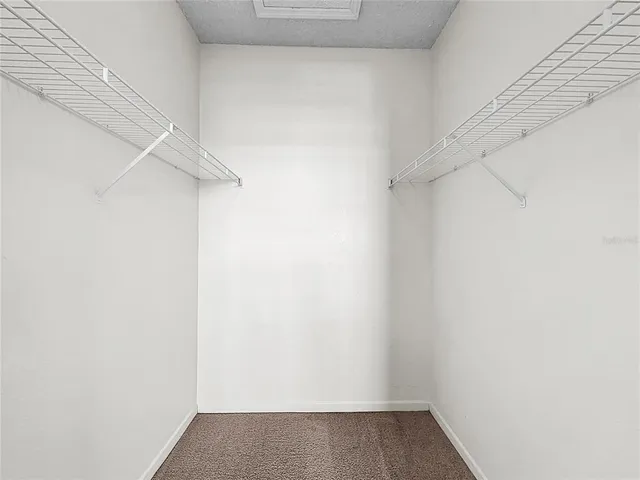 an aerial view of a house with a garden and swimming pool