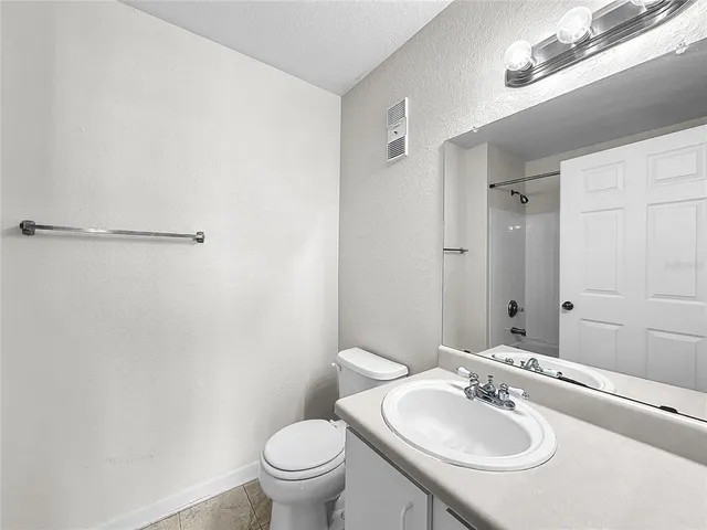 a view of a house with a backyard porch and sitting area