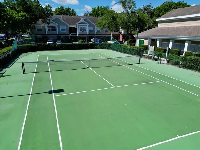 a living room with furniture a fireplace and a large window
