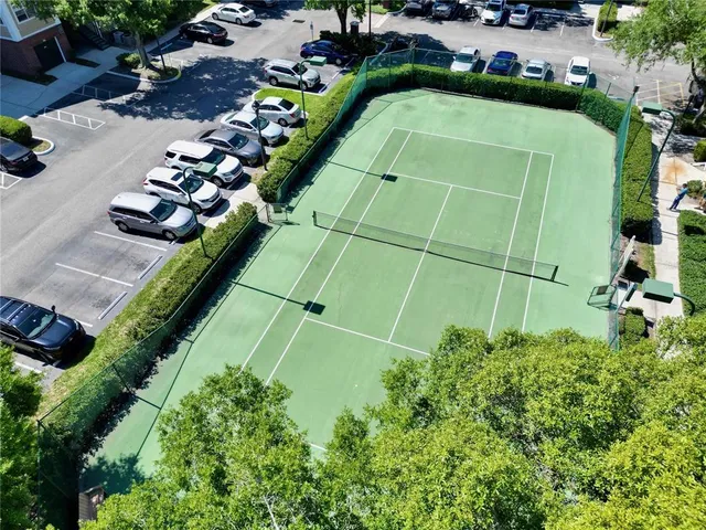 a large kitchen with granite countertop a large counter top and sink