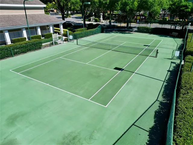 a living room with lots of furniture and a large window