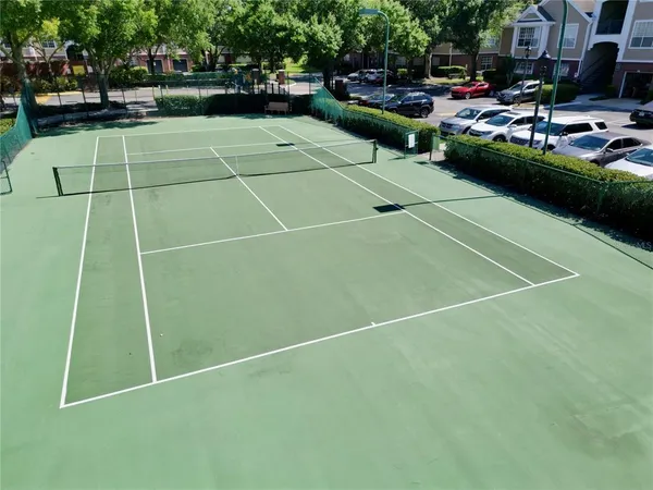 a view of a livingroom with workspace and a window