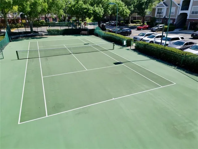 a view of a livingroom with workspace and a window