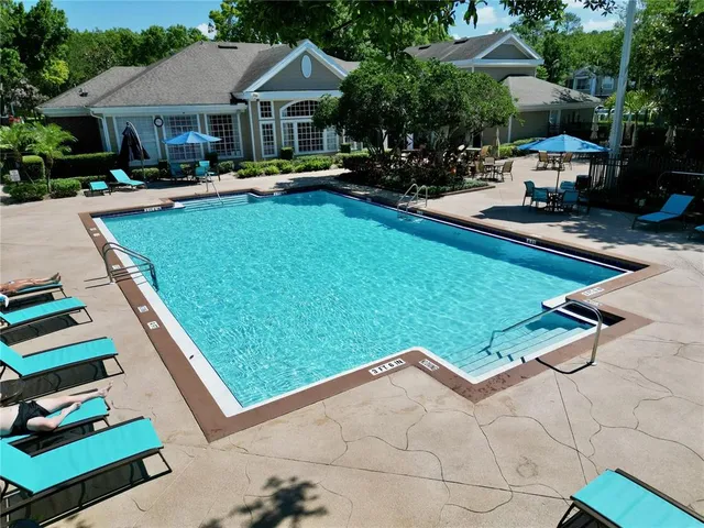 a view of a house with a yard porch and sitting area