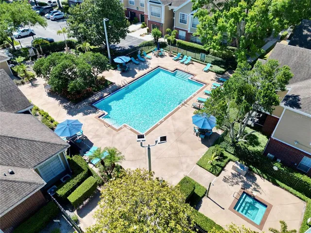 an aerial view of a town with trees