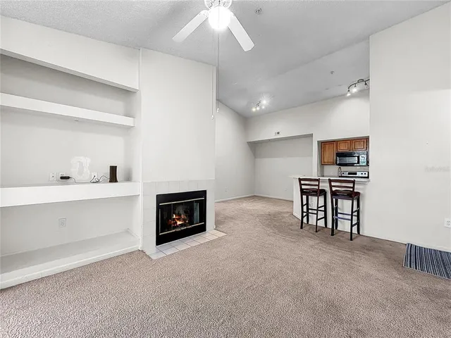 a kitchen with cabinets and steel appliances