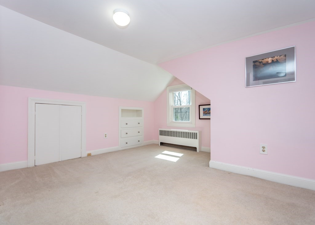 11 Whittier Rd Extension Natick, MA 01760 - Photo 12 of 19 an empty room with windows and fireplace