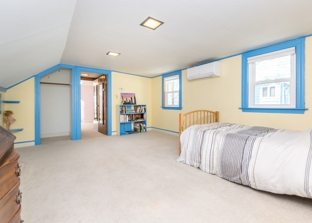 11 Whittier Rd Extension Natick, MA 01760 - Photo 14 of 19 a spacious bedroom with a bed and a cabinets