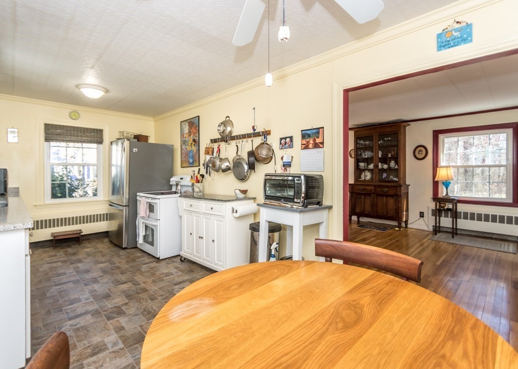 11 Whittier Rd Extension Natick, MA 01760 - Photo 4 of 19 a bed room with a bed and furniture