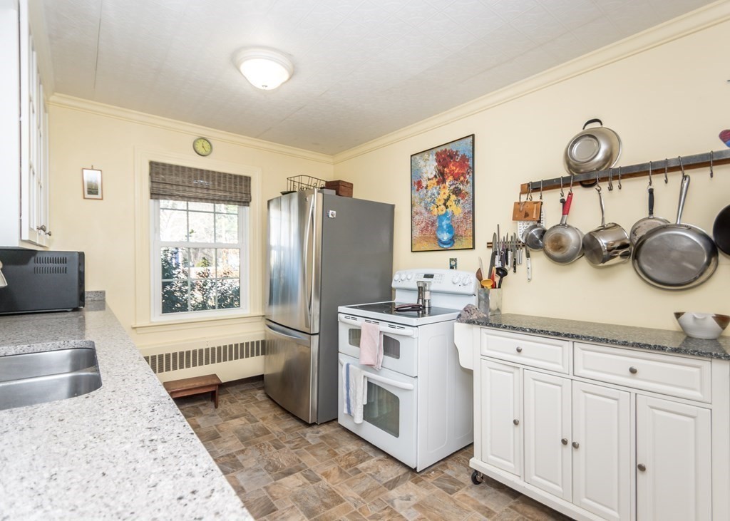 11 Whittier Rd Extension Natick, MA 01760 - Photo 6 of 19 a kitchen with a sink and a stove top oven