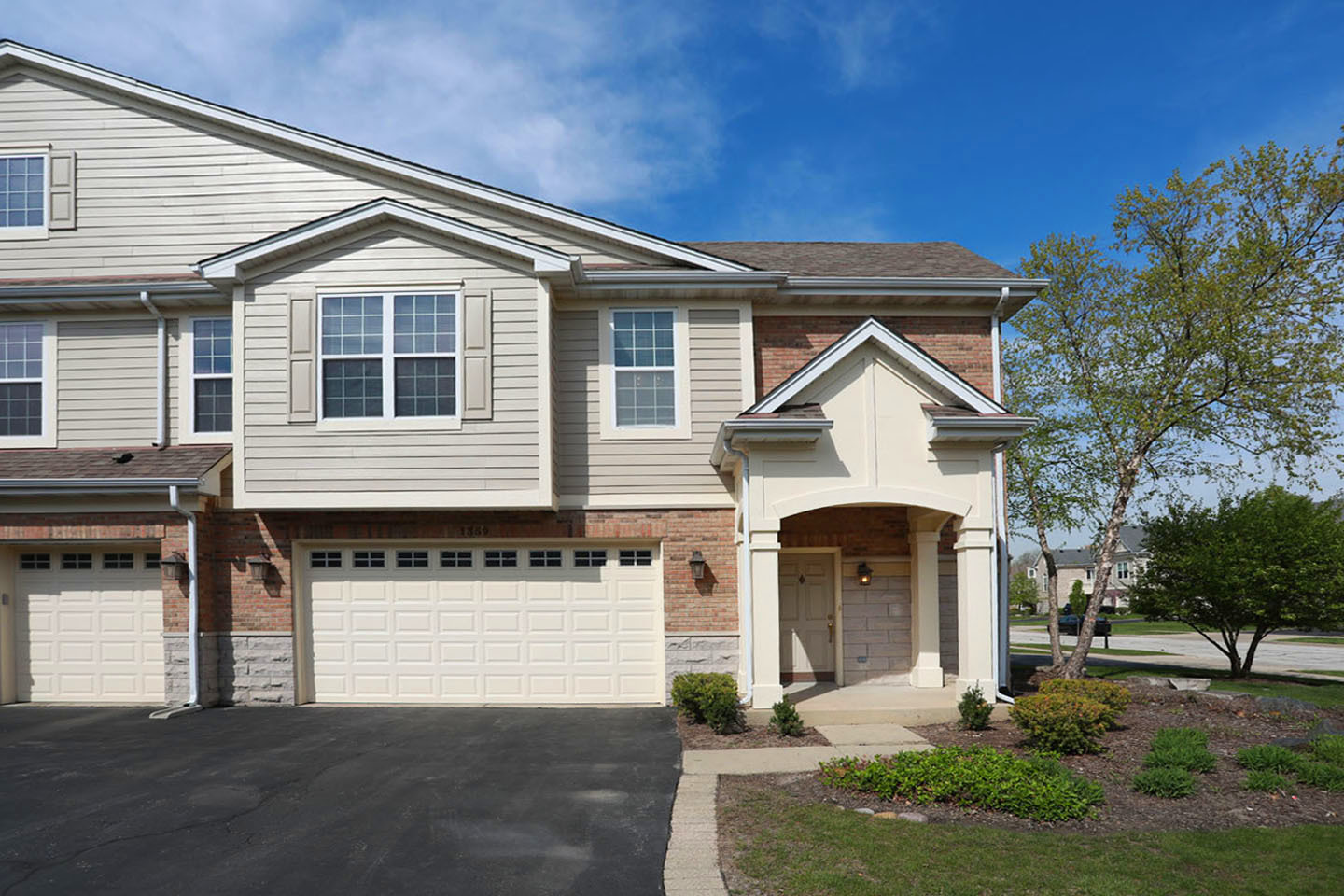 1359 Scarboro Road Schaumburg, IL 60193 - Photo 1 of 21 a front view of a house with a yard and garage