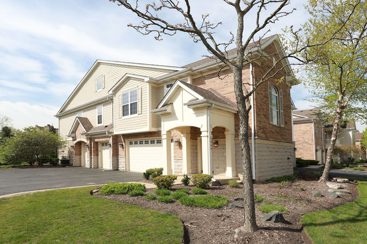 1359 Scarboro Road Schaumburg, IL 60193 - Photo 2 of 21 a front view of a house with garden