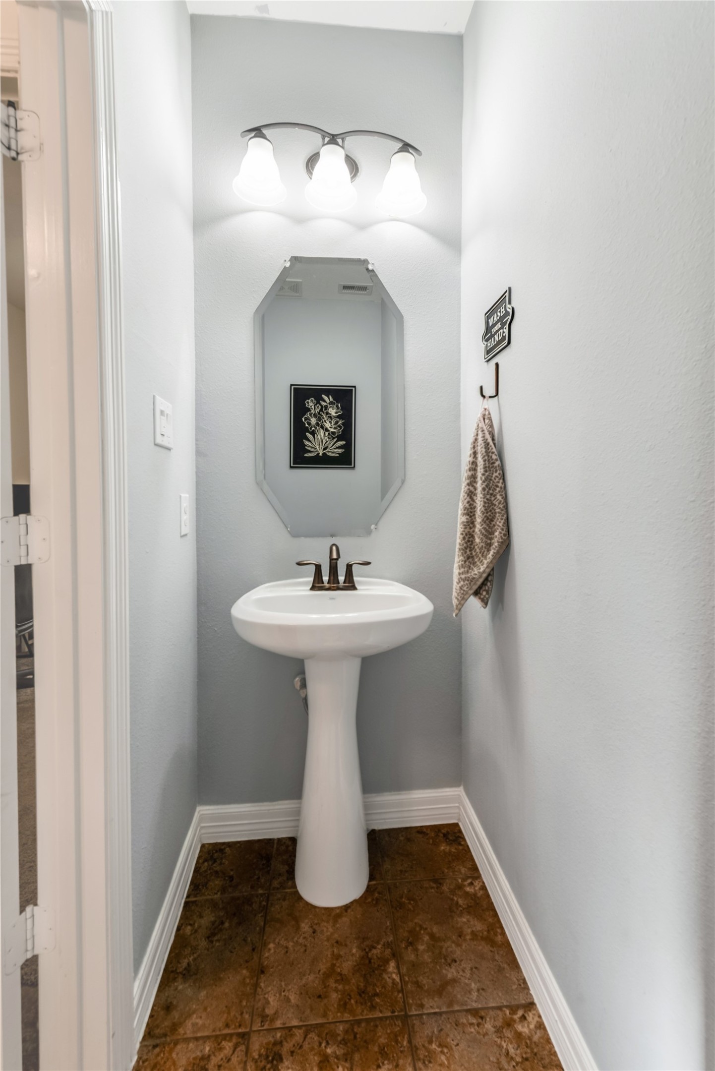 702 Aulia Lane Spring, TX 77386 - Photo 15 of 37 a bathroom with a sink and mirror