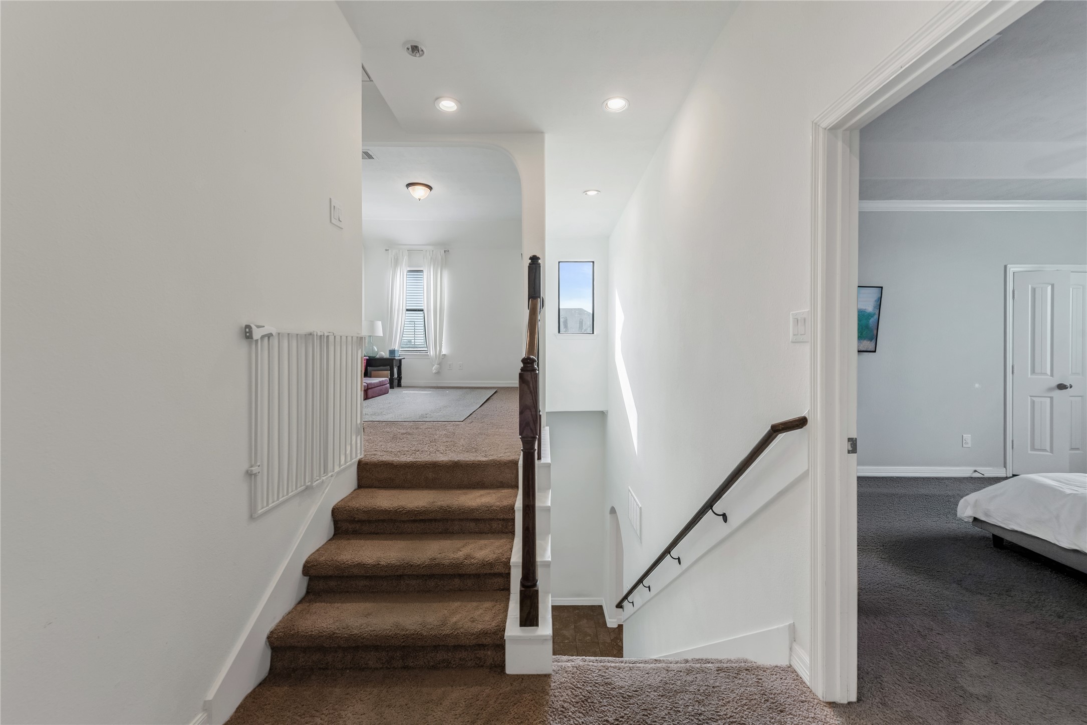 702 Aulia Lane Spring, TX 77386 - Photo 17 of 37 a view of a hallway with wooden floor and stairs