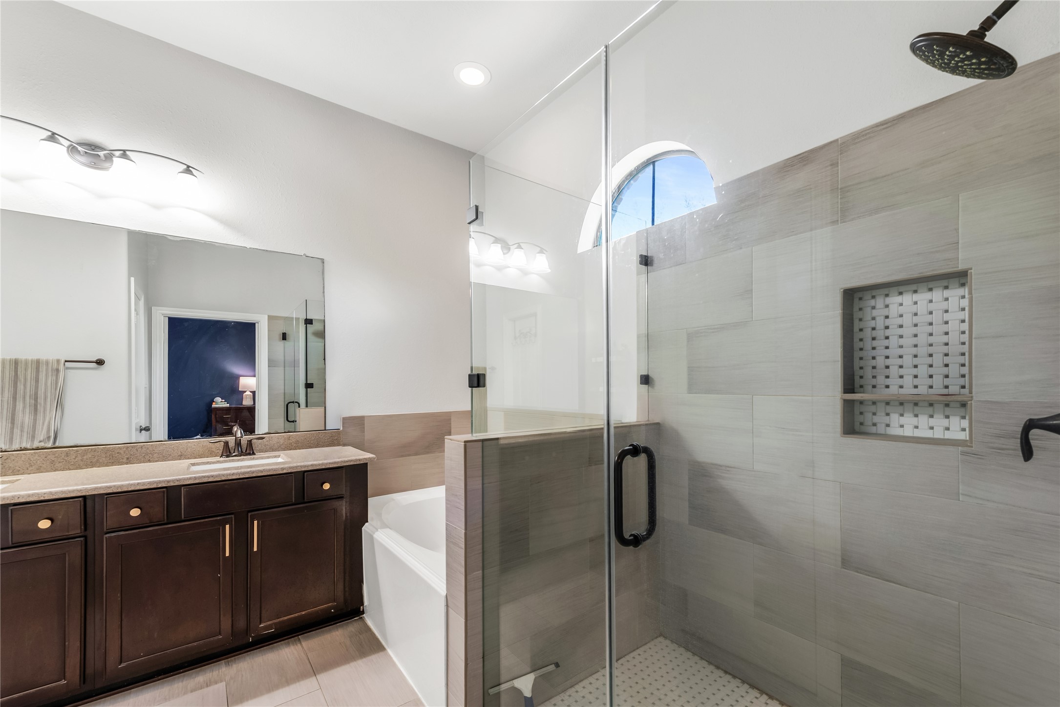 702 Aulia Lane Spring, TX 77386 - Photo 20 of 37 a bathroom with a double vanity sink mirror and shower