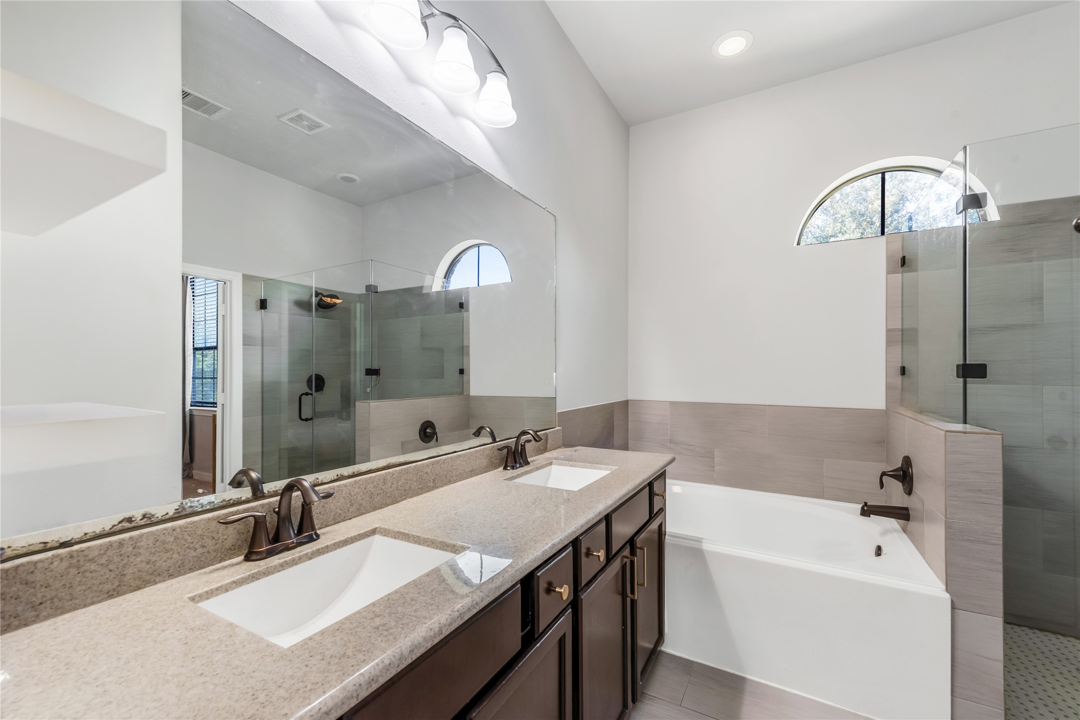 702 Aulia Lane Spring, TX 77386 - Photo 21 of 37 a bathroom with a tub sink and mirror