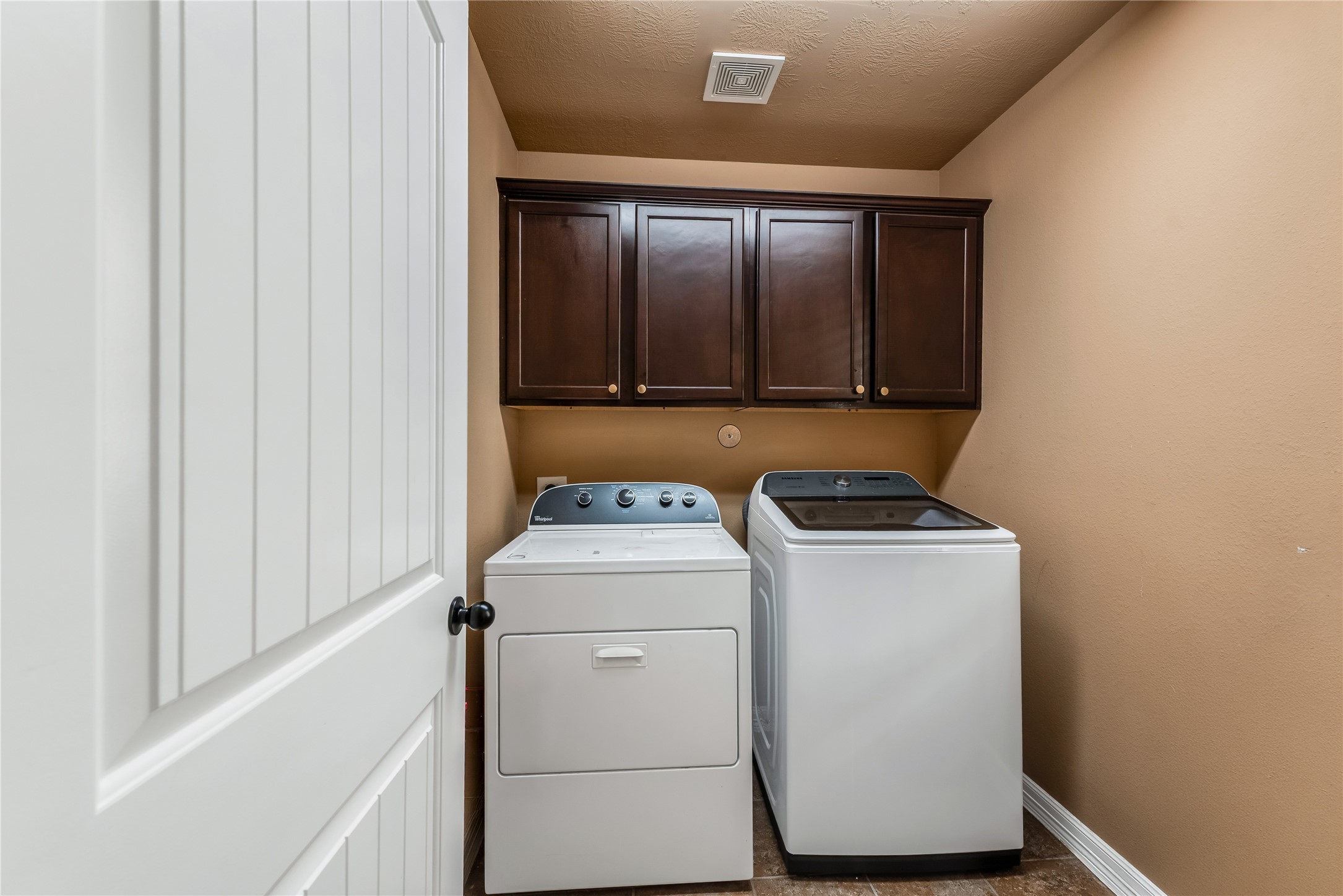 702 Aulia Lane Spring, TX 77386 - Photo 23 of 37 a view of storage and utility room with washer and dryer
