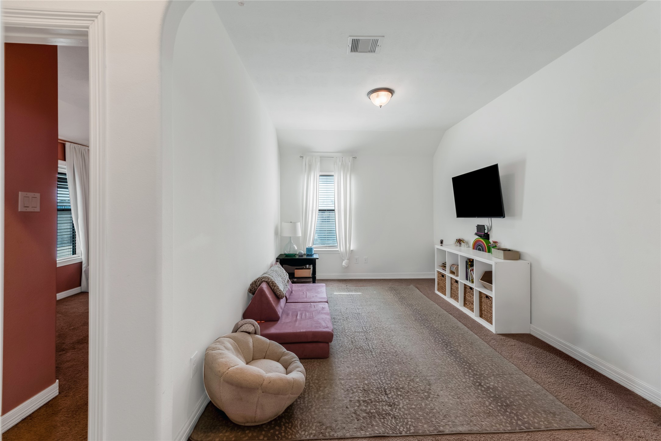 702 Aulia Lane Spring, TX 77386 - Photo 25 of 37 a living room with furniture and a flat screen tv