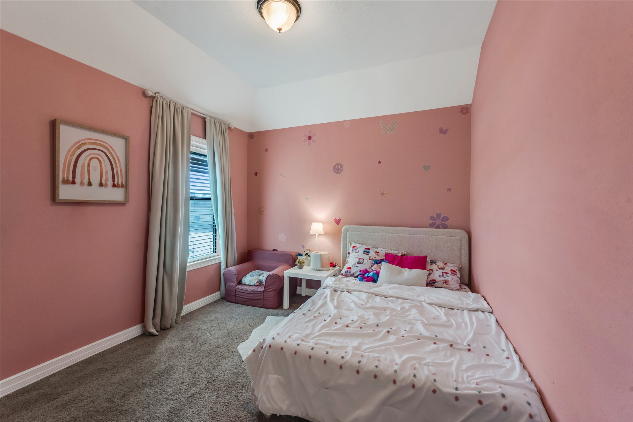 702 Aulia Lane Spring, TX 77386 - Photo 26 of 37 a bedroom with a bed and a chandelier