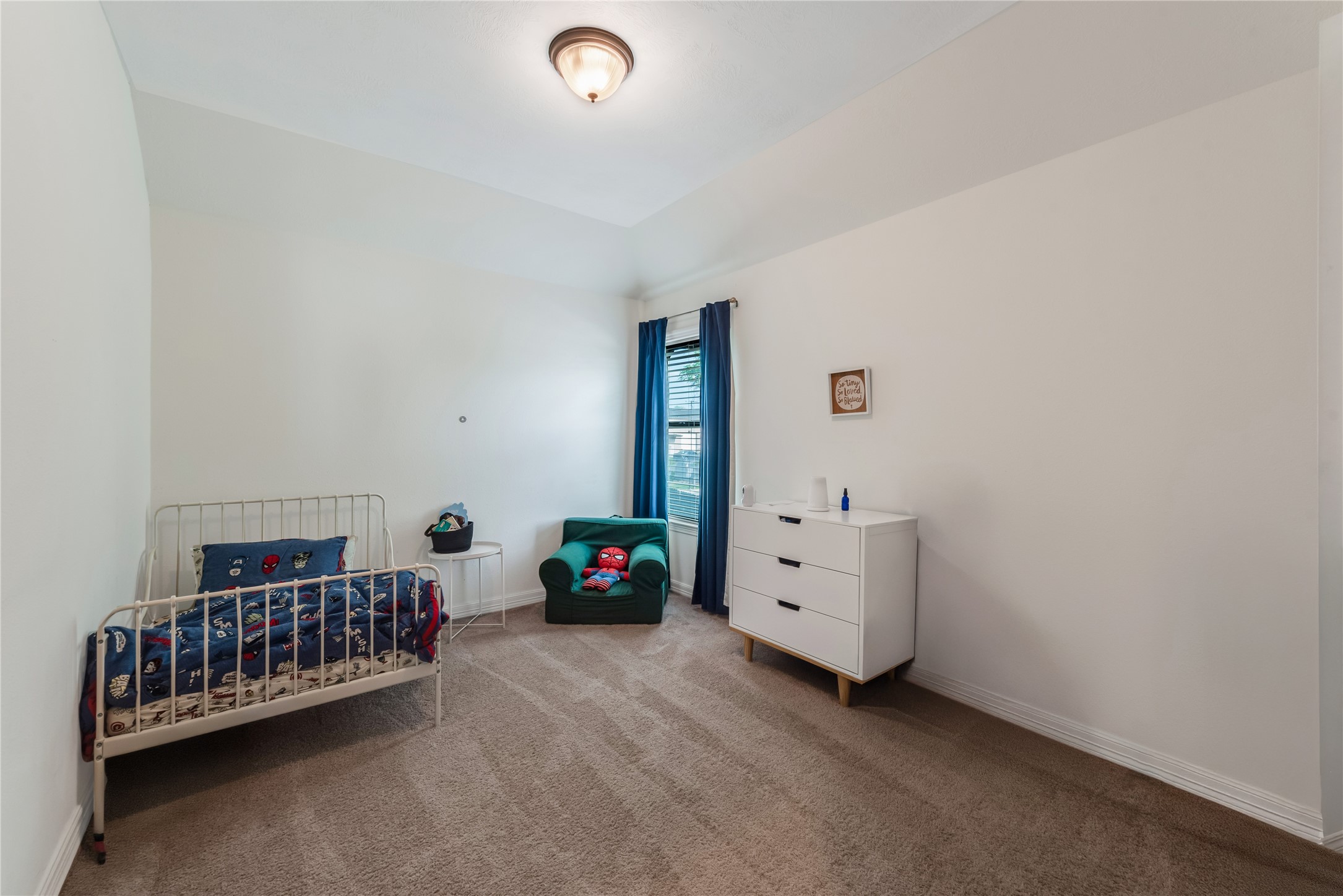 702 Aulia Lane Spring, TX 77386 - Photo 27 of 37 a bedroom with furniture and baby crib