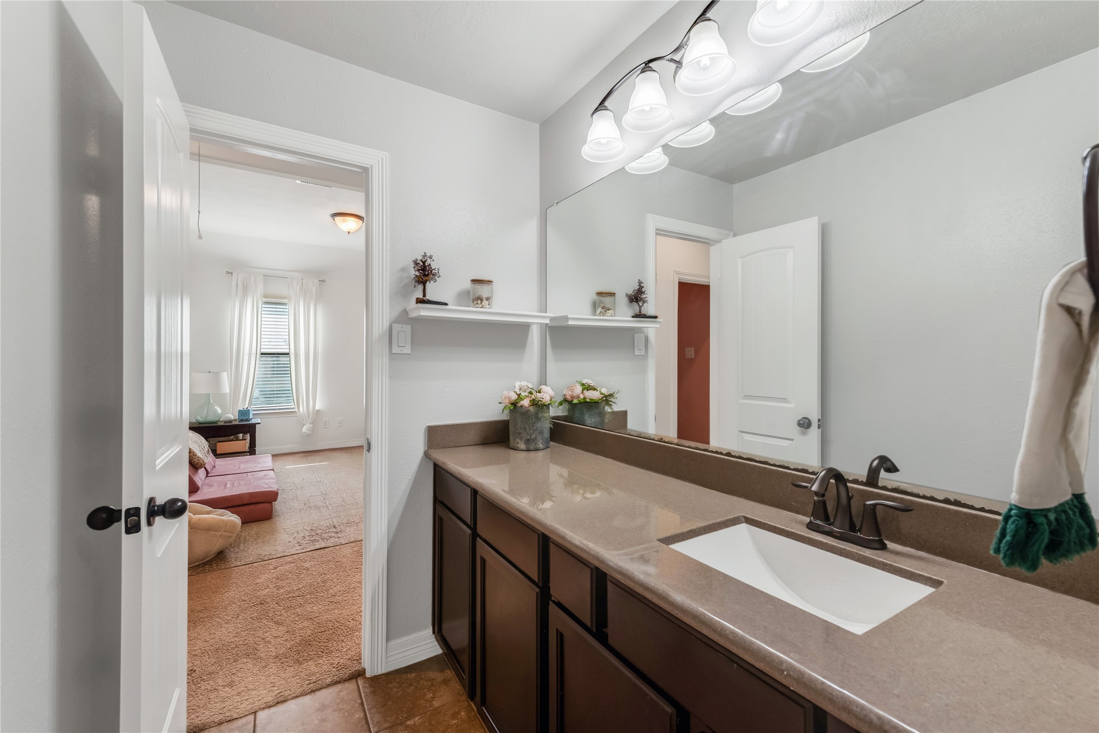 702 Aulia Lane Spring, TX 77386 - Photo 28 of 37 a bathroom with a sink double vanity and a mirror