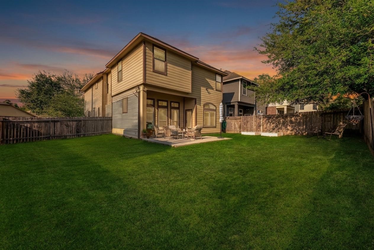 702 Aulia Lane Spring, TX 77386 - Photo 30 of 37 a front view of house with a garden