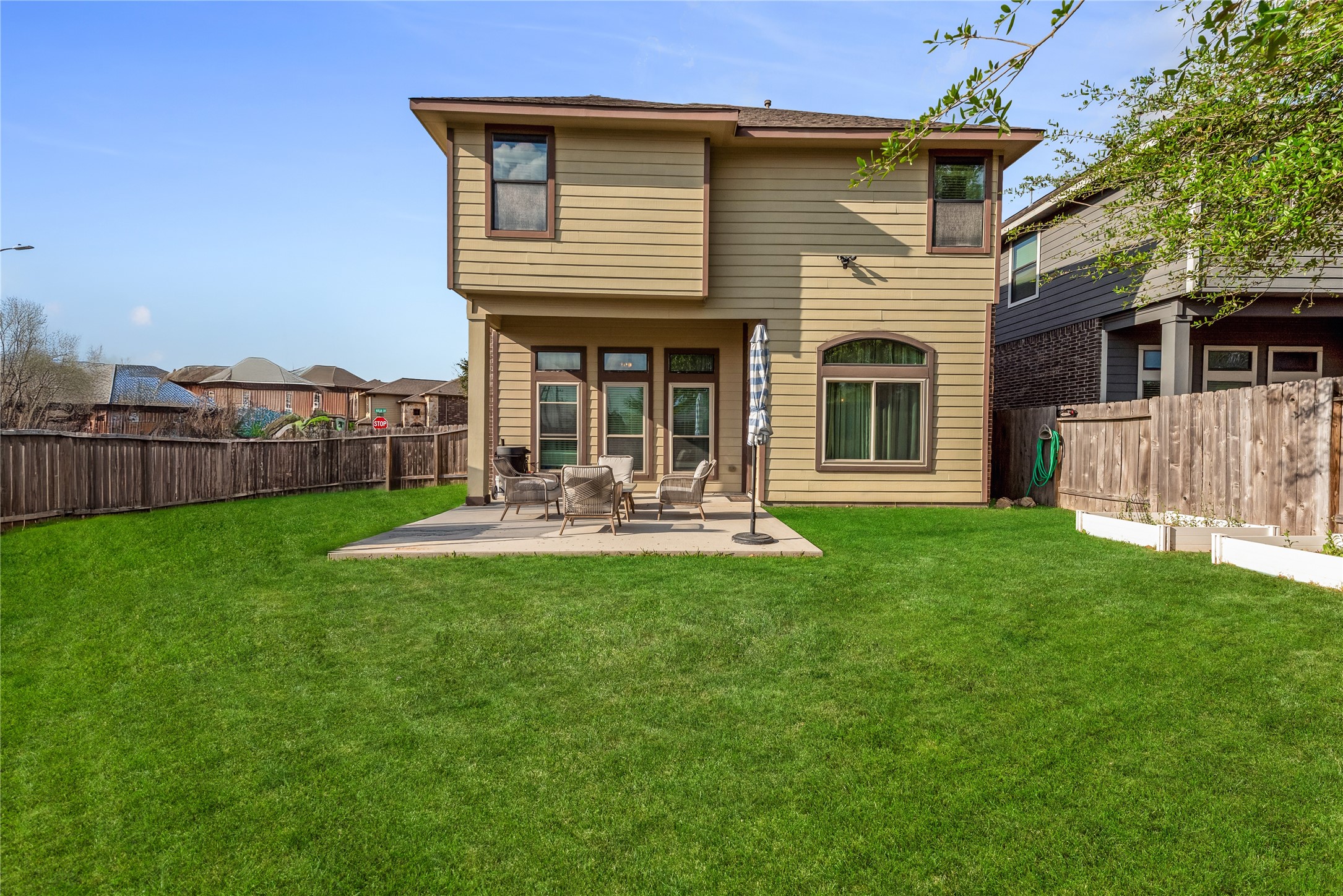 702 Aulia Lane Spring, TX 77386 - Photo 31 of 37 a front view of a house with a yard table and chairs