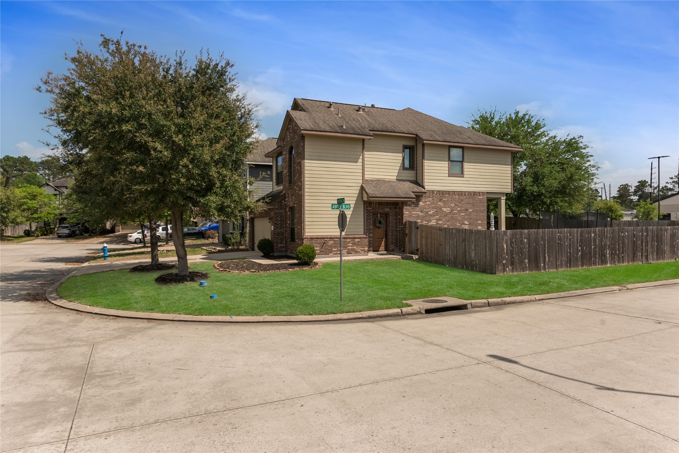 702 Aulia Lane Spring, TX 77386 - Photo 4 of 37 a backyard of a house with a garden and plants