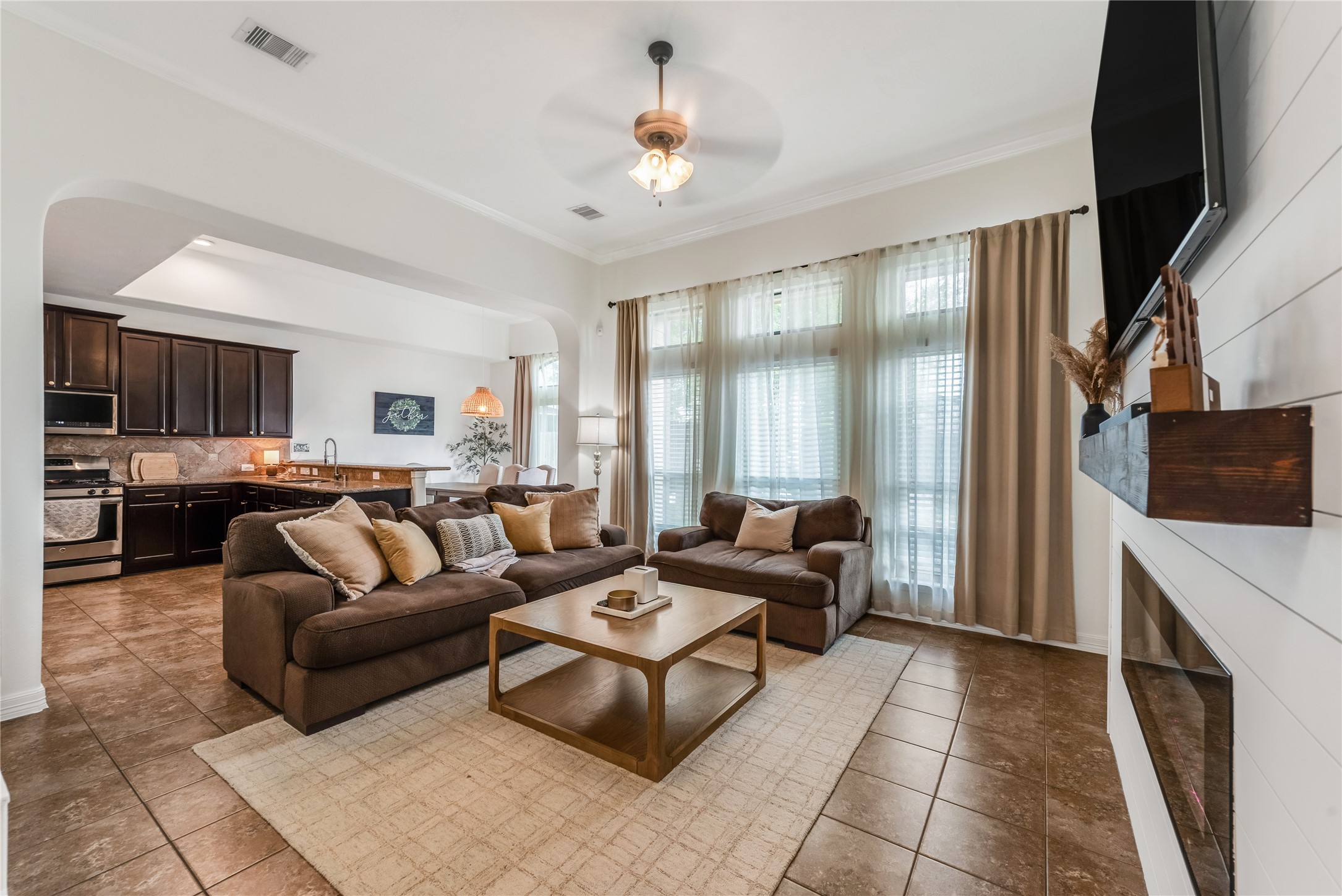702 Aulia Lane Spring, TX 77386 - Photo 7 of 37 a living room with furniture and a flat screen tv