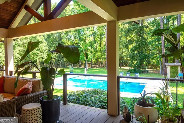 a view of a dining room with furniture window and outside view