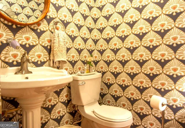 a front view of a house with a yard table and chairs