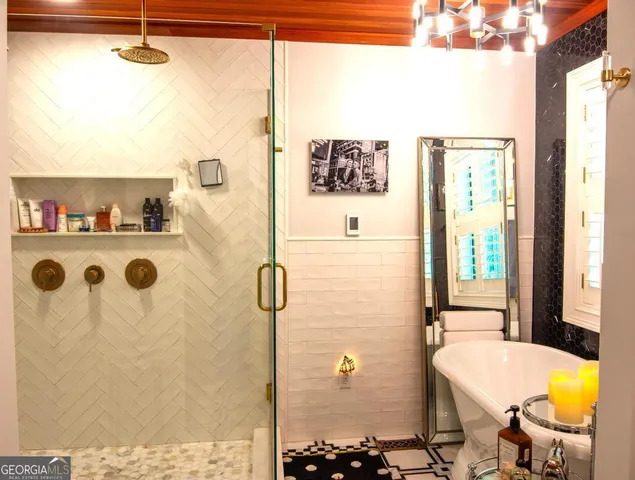 a en suite bathroom with a sink and a mirror