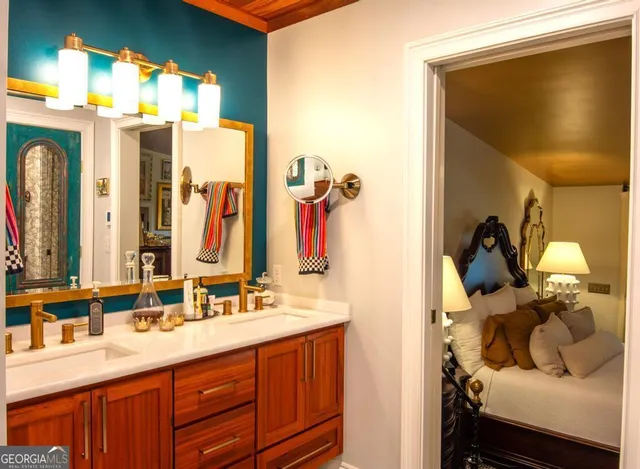 a view of walk in closet and bathroom