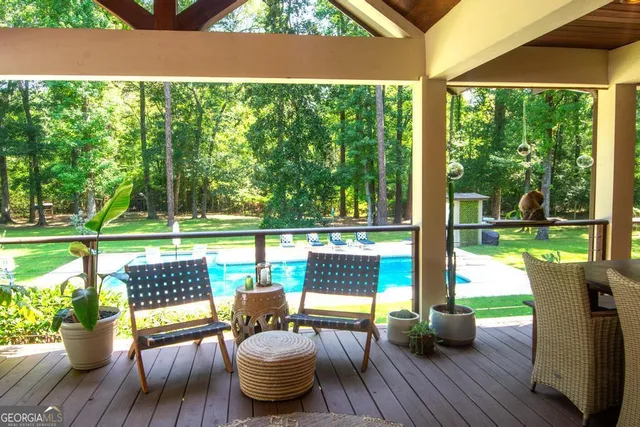 a view of a dining room with furniture window and outside view