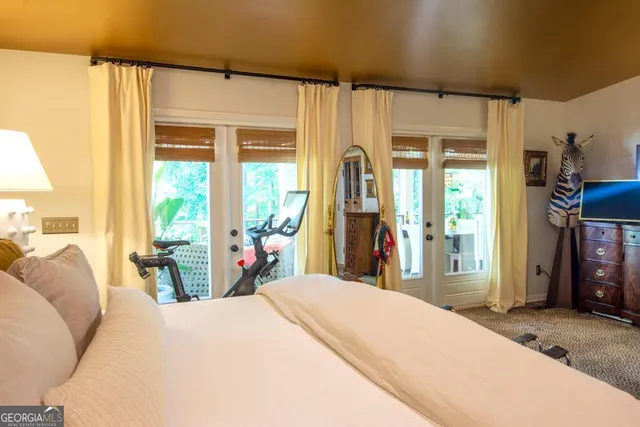 a bathroom with a granite countertop shower and a sink
