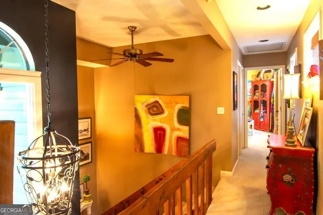 a view of a balcony with furniture and floor to ceiling window