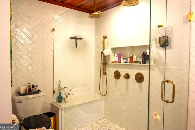 a bathroom with a tub and a shower