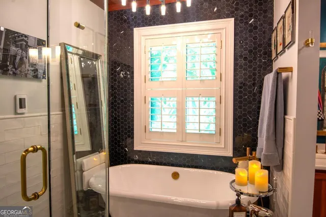 a bathroom with a sink a toilet and tub