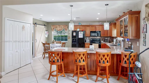 a view of a dining room with furniture and window