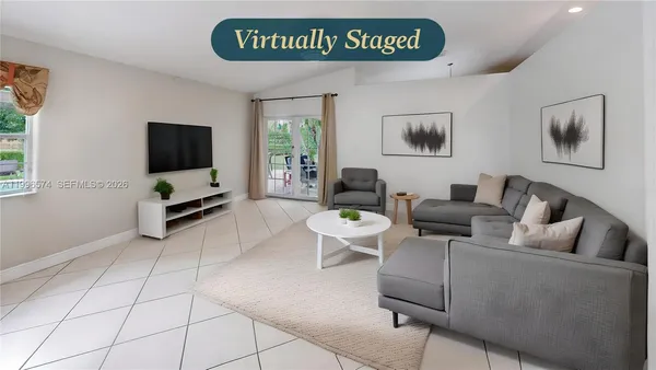 a bathroom with a tub sink double vanity and shower