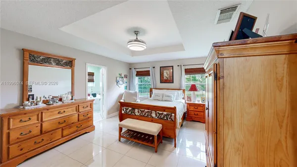 a view of a bathroom with a sink and mirror