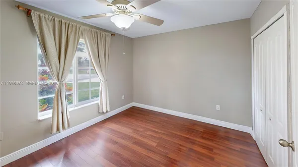 a view of swimming pool with chairs and table on the patio