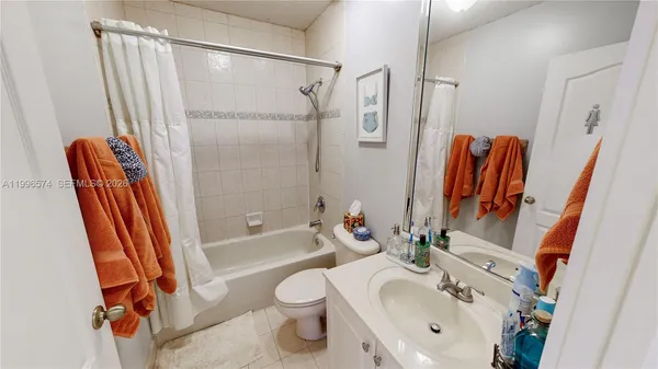 an aerial view of a house with outdoor space and sitting area