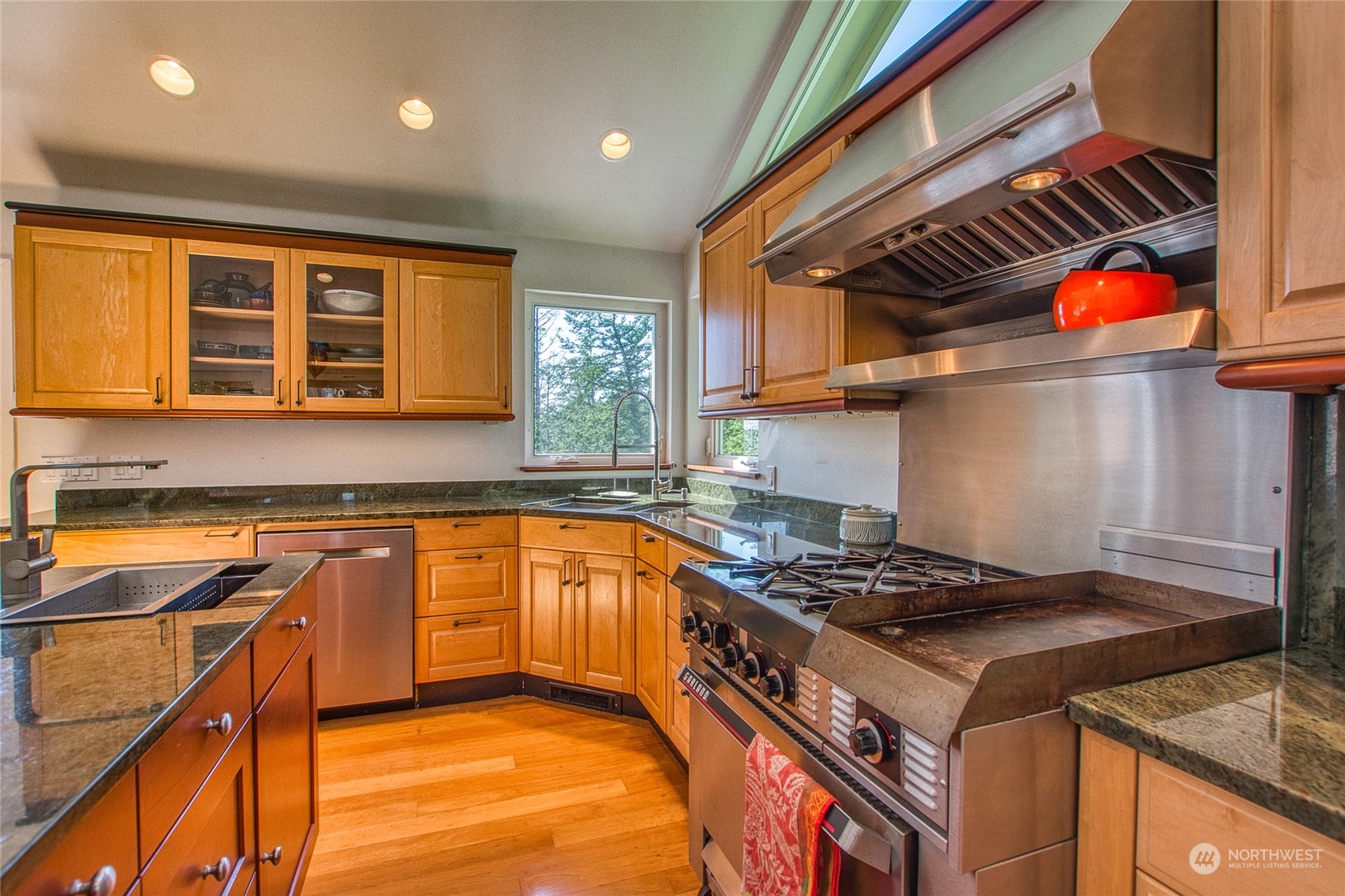 381 Geiser Way Orcas Island, WA 98245 - Photo 11 of 40 a kitchen with stainless steel appliances granite countertop a stove a sink and a microwave