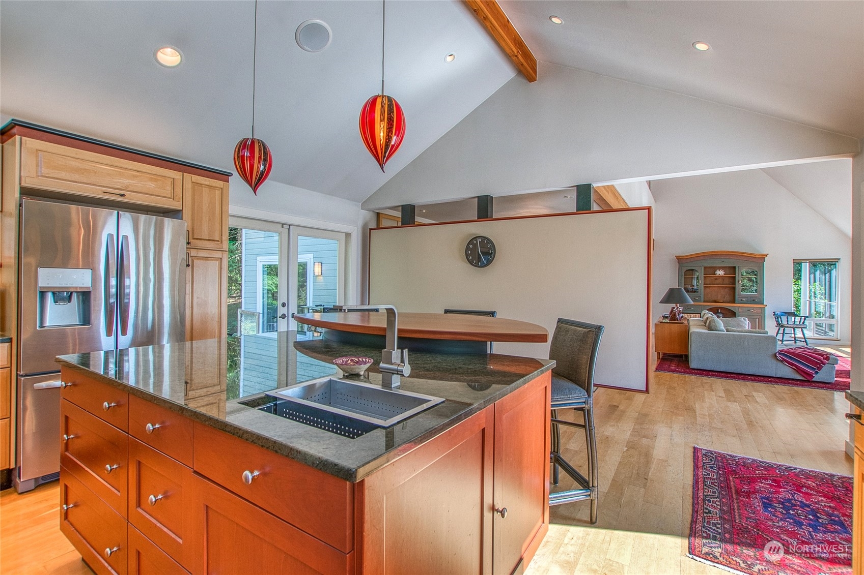 381 Geiser Way Orcas Island, WA 98245 - Photo 12 of 40 a kitchen with stainless steel appliances granite countertop a sink and a refrigerator